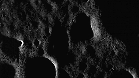 Image acquired by the Lunar Reconnaissance Orbiter Narrow Angle Camera is near the North Pole. It is ~9.3 km in width. The Sun is shining from the left, less than one degree above the horizon. Credit: NASA/GSFC/ASU